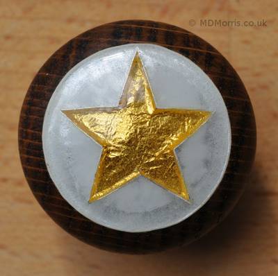 Cloisonné Enamel Doorknob showing a Gold Pret-a-Manger Star with Opal Background