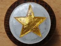 Cloisonné Enamel Doorknob showing a Gold Pret-a-Manger Star with Opal Background