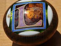 Side view of Letter-L cloisonné enamel door knob by Mark Morris