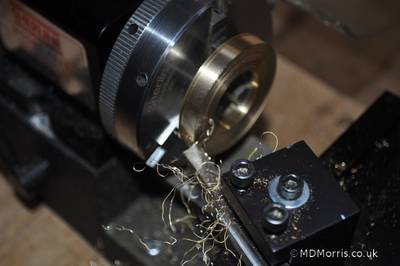 leaving a small amount of material next to the lathe chuck