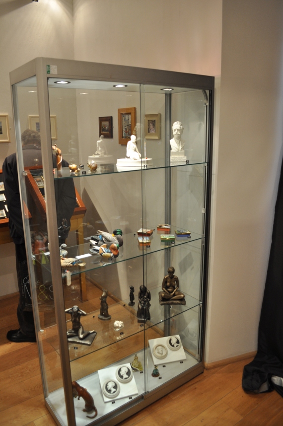 Display cabinet with enamel boxes in